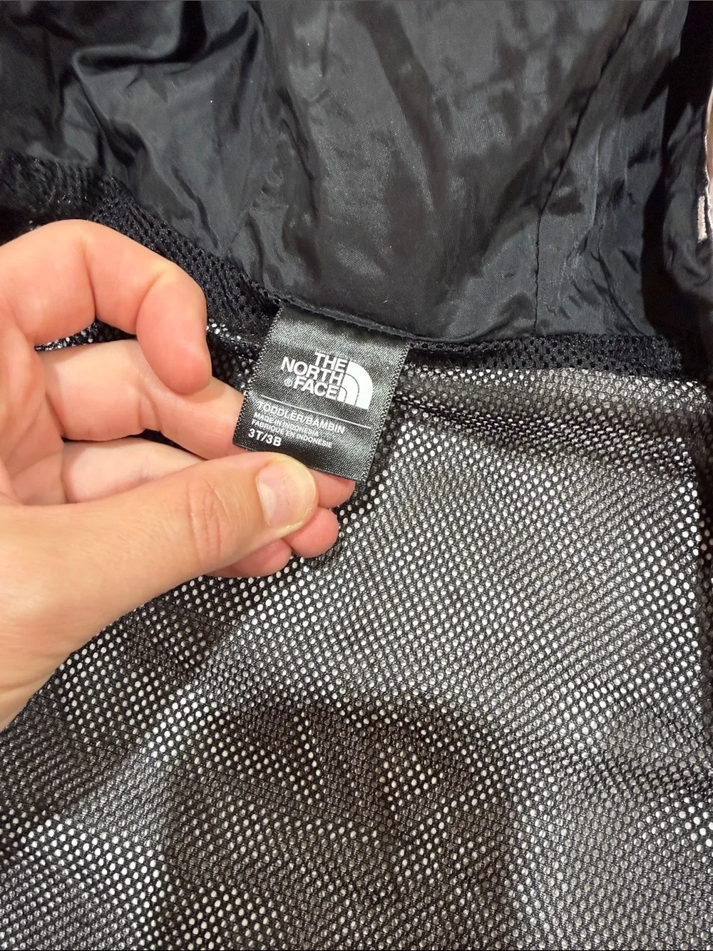 The North Face Kids Hooded Rain Jacket in Light Pink and Black
